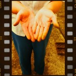 Caterpillars. Image of womans hands